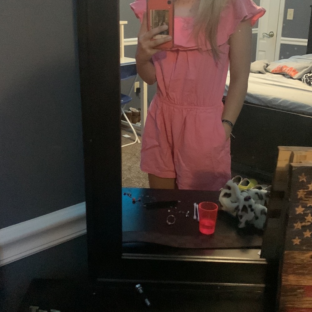 pink romper.